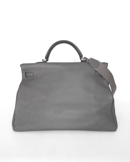 Rare Hermès HSS Kelly 50 Voyage travel bag in elephant‑grey matte Clémence leather, VIP‑commissioned (HSS stamp) with iconic turn‑lock and internal zipped & slit pockets