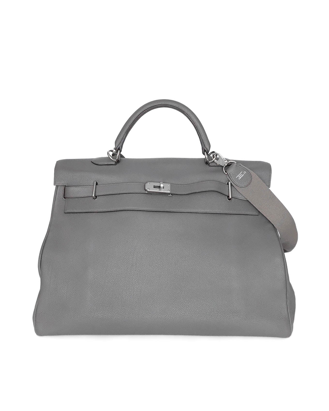Hermès Kelly 50 Voyage in Gris Etain Clémence leather (2018), with tonal special‑order cotton strap and interior zipped & slit pockets
